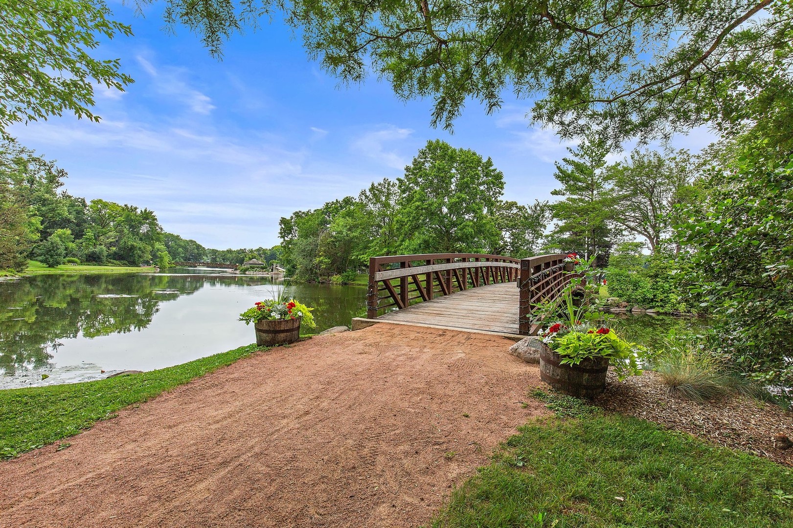 25287 Wren Road Tower Lakes, IL 60010 - Photo 48 of 51 a view of a lake with a garden