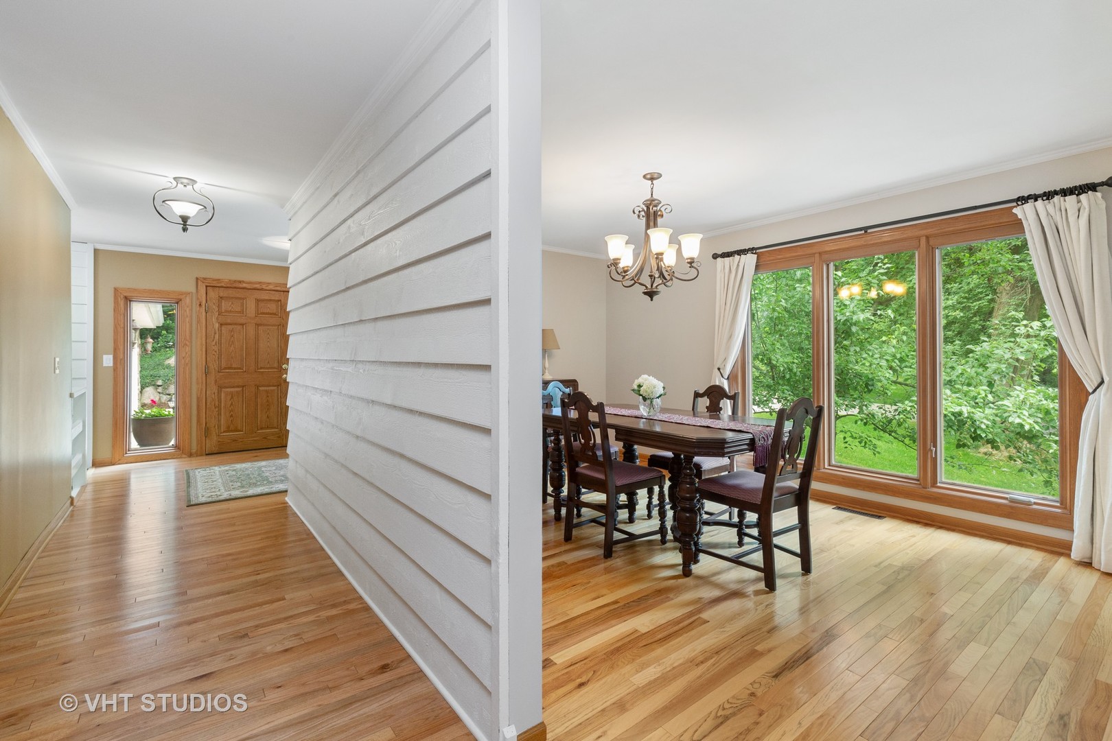 25287 Wren Road Tower Lakes, IL 60010 - Photo 9 of 51 a view of a dining room with furniture window and wooden floor