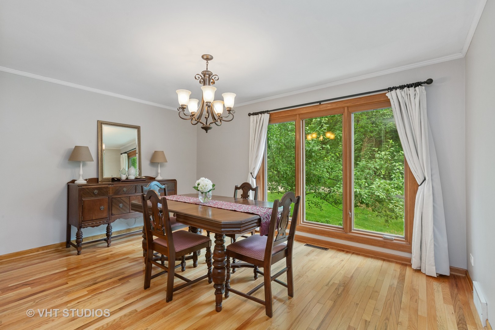 25287 Wren Road Tower Lakes, IL 60010 - Photo 10 of 51 a view of a dining room with furniture window and wooden floor