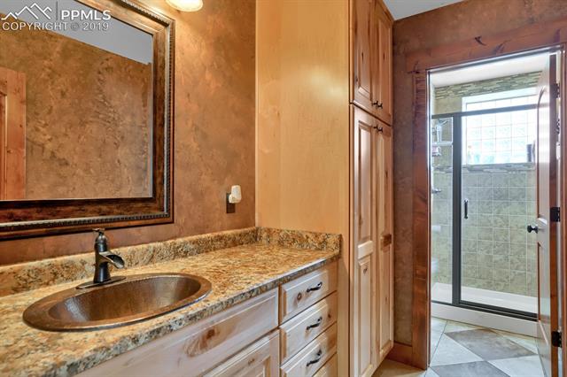 10980 Huntsman Road Colorado Springs, CO 80908 - Photo 34 of 35 basement hall 3/4 bath