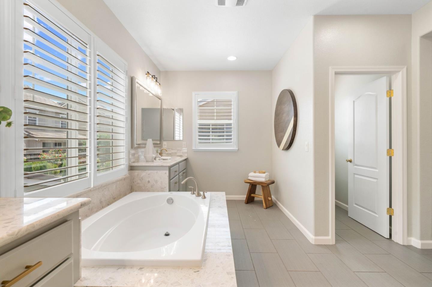 7026 Syrah Drive Dublin, CA 94568 - Photo 35 of 54 a bathroom with a tub a toilet and a sink