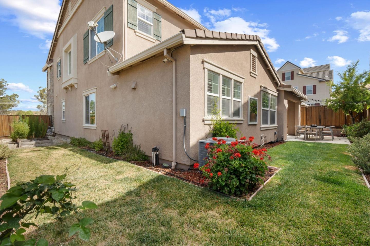 7026 Syrah Drive Dublin, CA 94568 - Photo 50 of 54 a front view of a house with garden