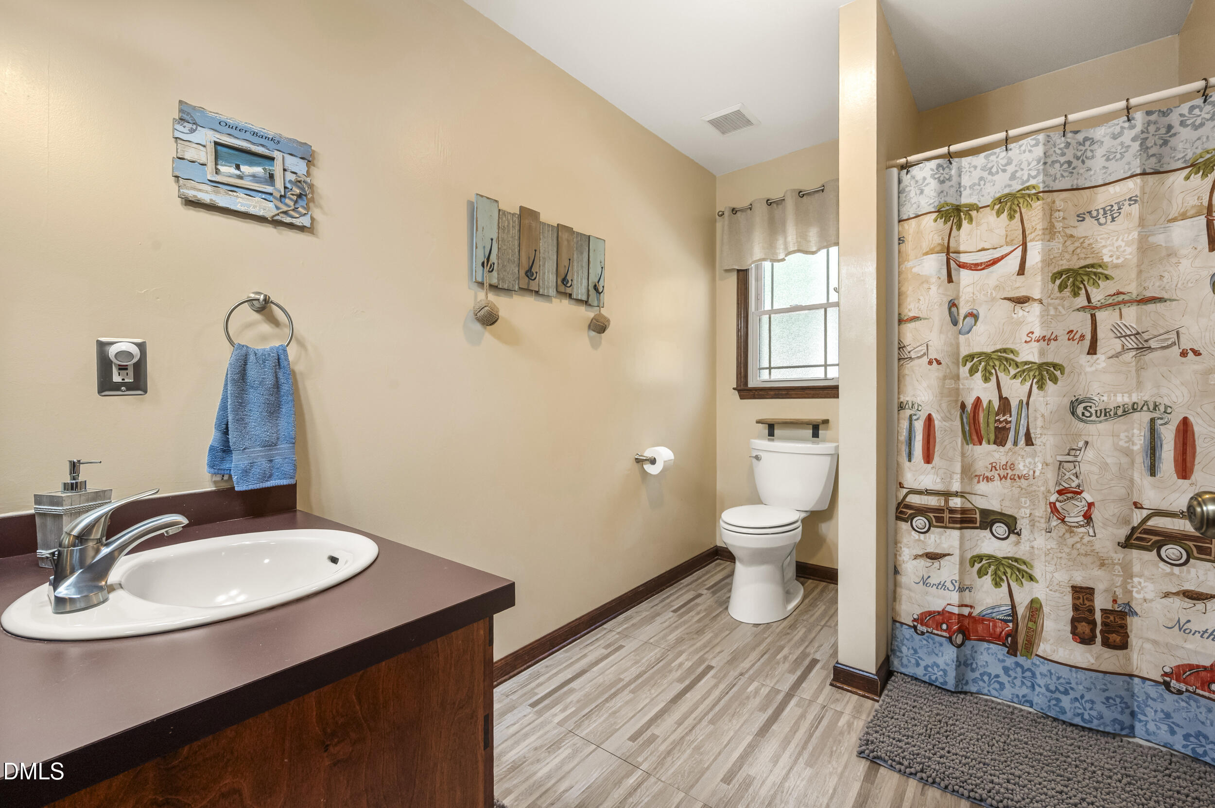 4209 Lassiter Road Wake Forest, NC 27587 - Photo 36 of 39 a bathroom with a sink toilet a mirror and shower