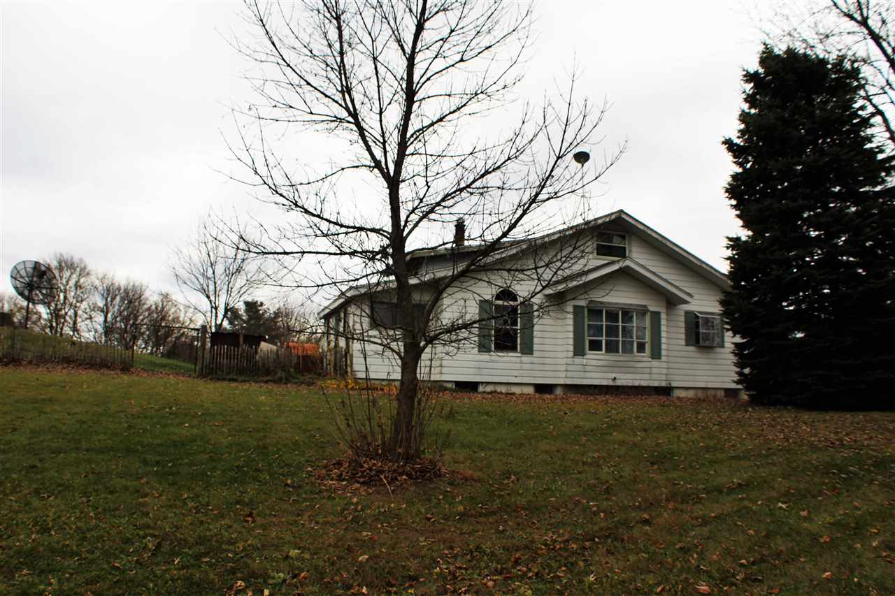 1601 Wheeler Road Cherry Valley, IL 61016 - Photo 1 of 18 a view of house with a yard