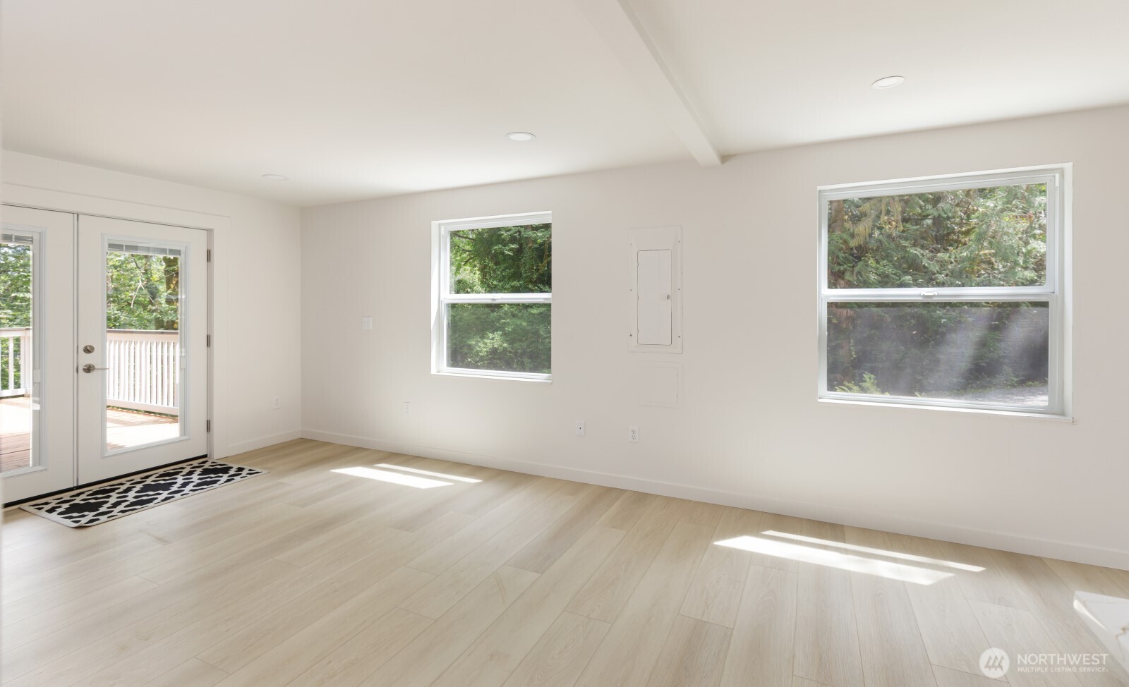 7605 Northeast Hidden Cove Road Bainbridge Island, WA 98110 - Photo 36 of 36 a view of an empty room with a window