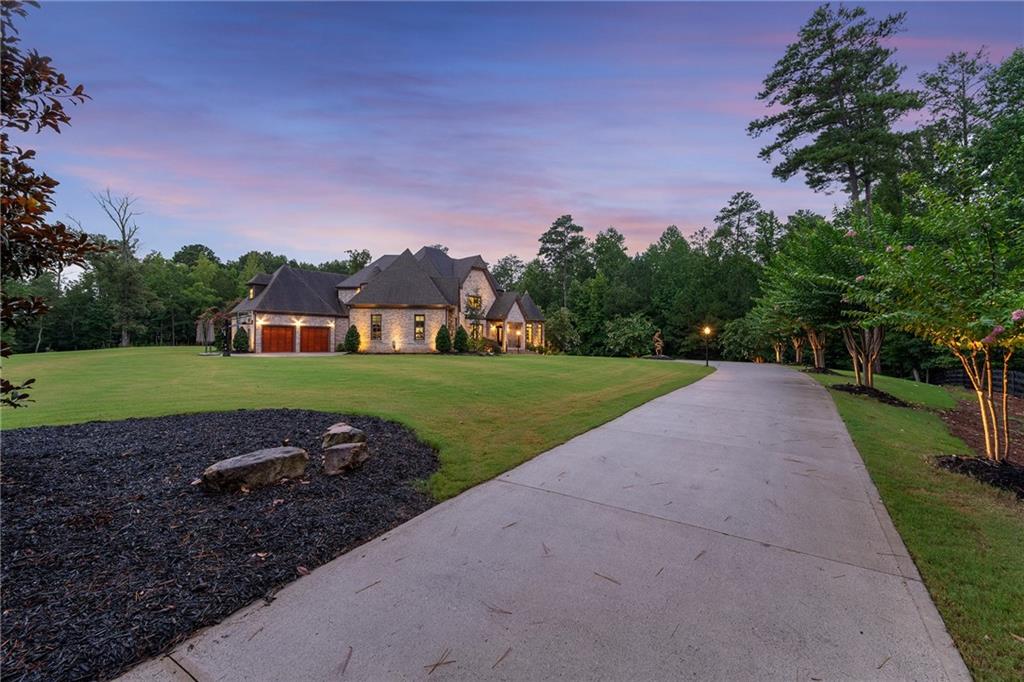 14560 Wood Road Milton, GA 30004 - Photo 64 of 74 a view of a house with a yard
