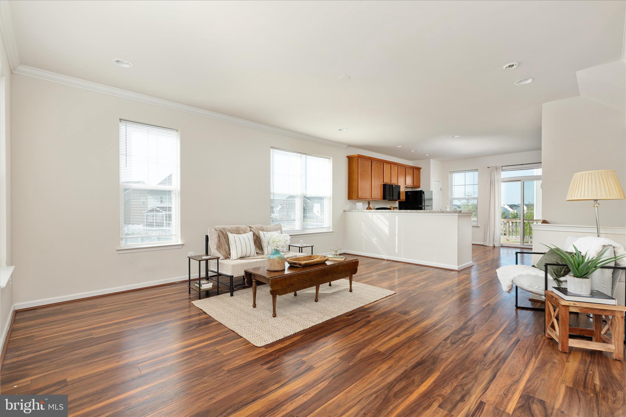 109 Splendor Garden Way Stephenson, VA 22656 - Photo 12 of 58 a living room with furniture a wooden floor and a window