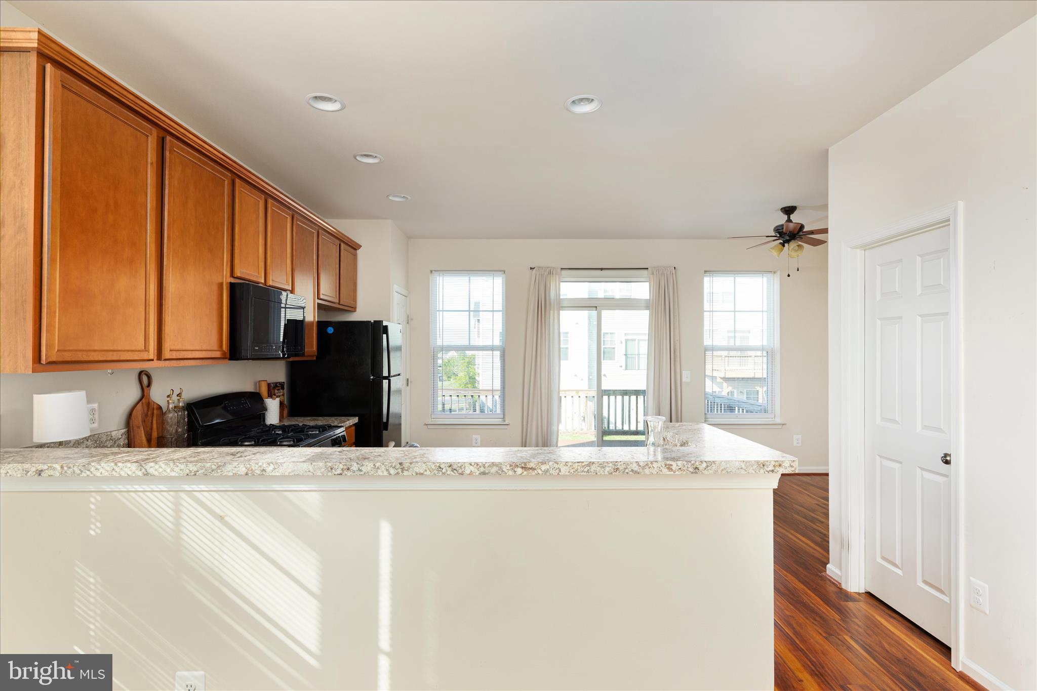 109 Splendor Garden Way Stephenson, VA 22656 - Photo 14 of 58 a kitchen with stainless steel appliances granite countertop a sink a stove and a refrigerator