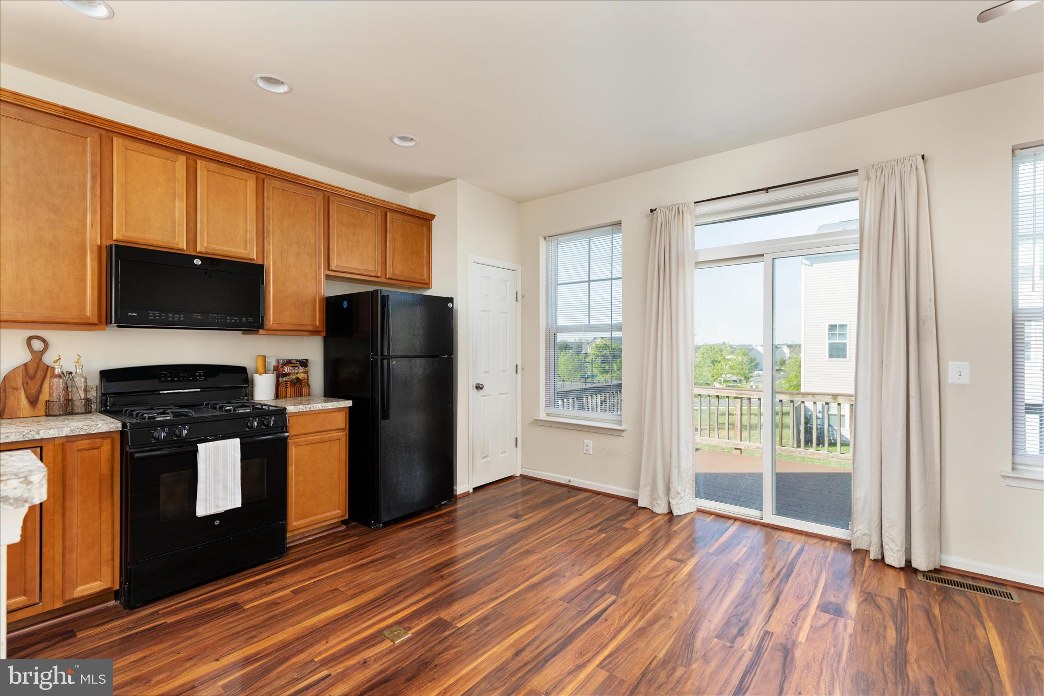 109 Splendor Garden Way Stephenson, VA 22656 - Photo 15 of 58 a kitchen with stainless steel appliances granite countertop a refrigerator stove top oven and sink