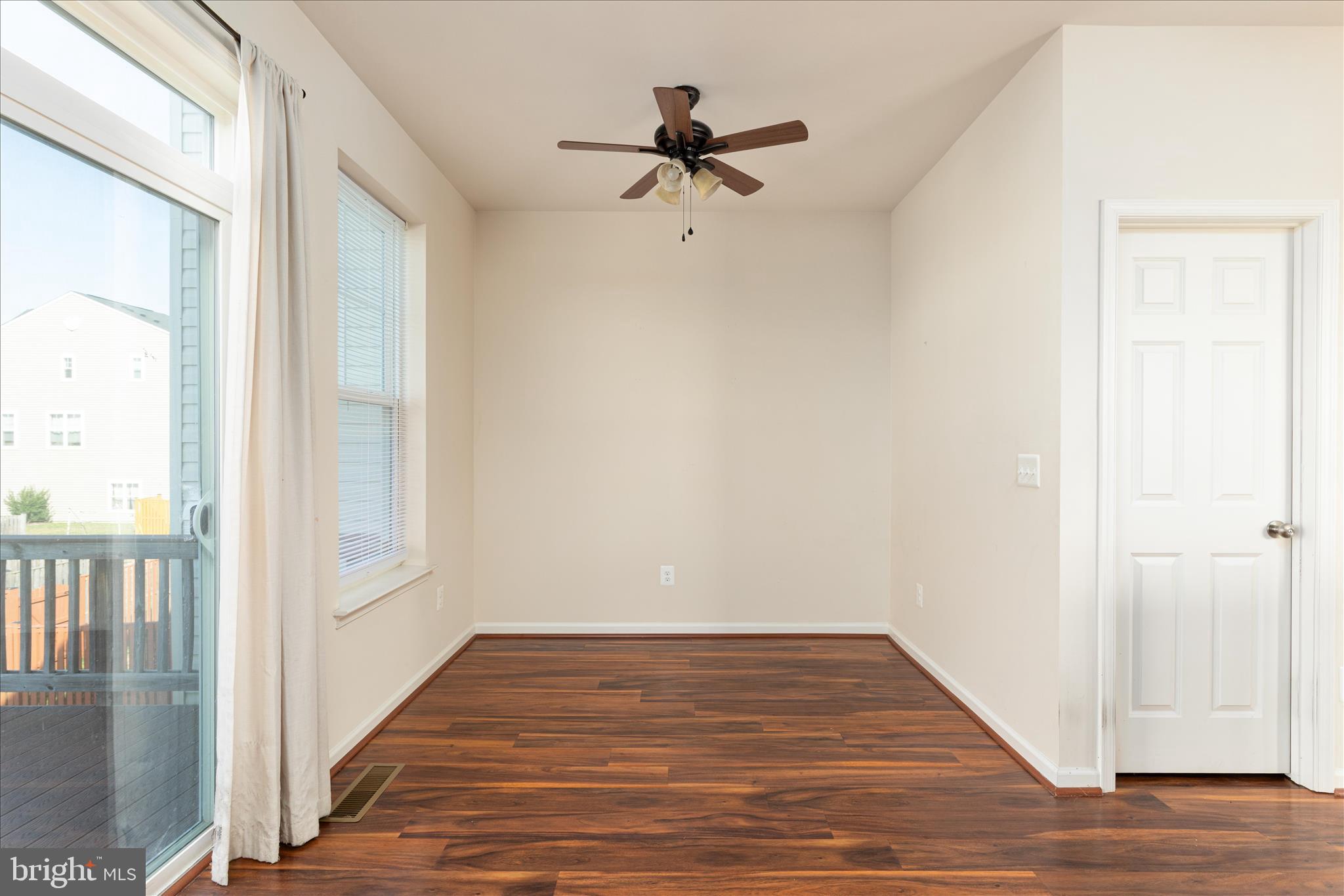 109 Splendor Garden Way Stephenson, VA 22656 - Photo 17 of 58 a view of a livingroom with wooden floor and a ceiling fan