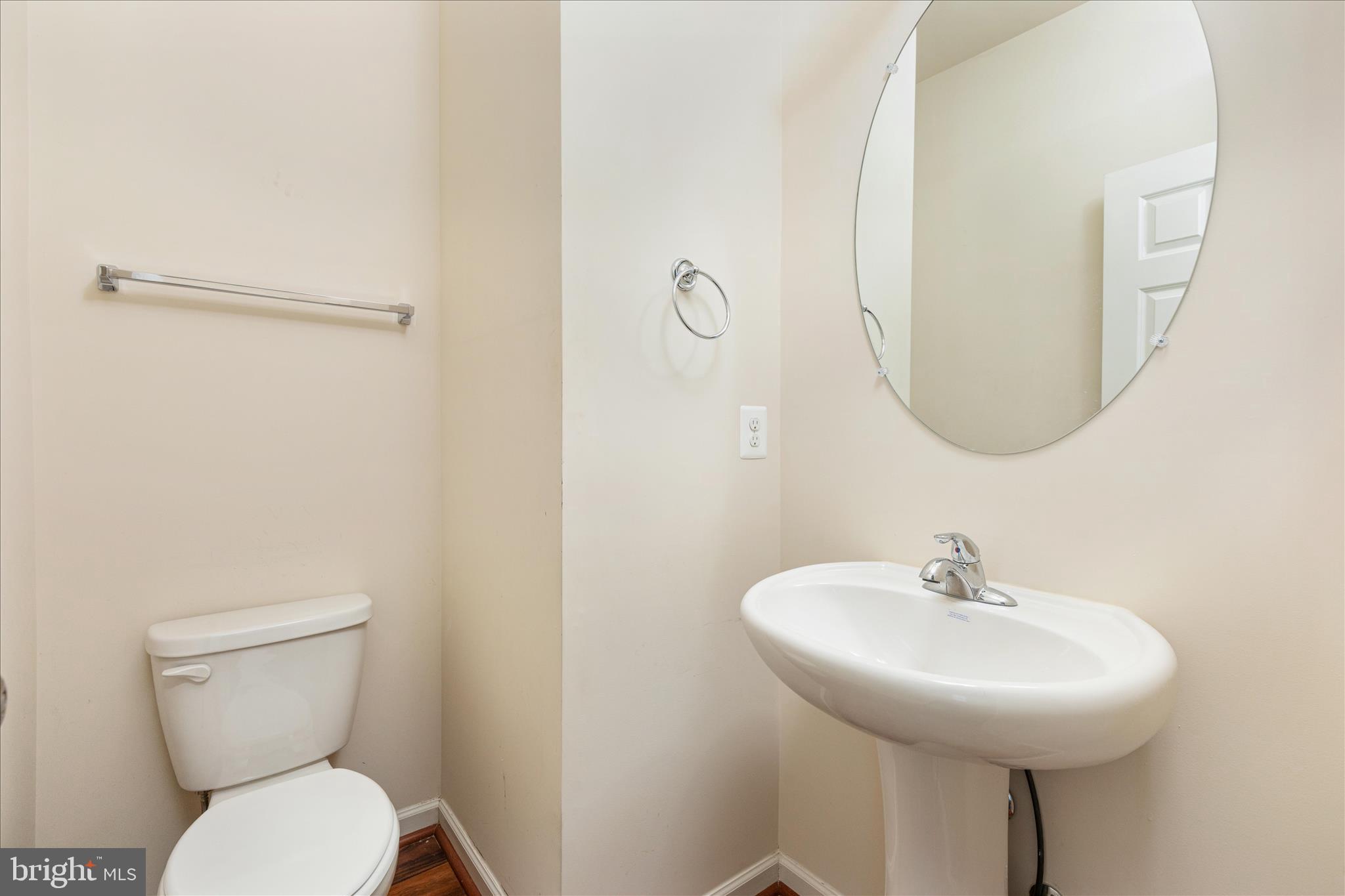 109 Splendor Garden Way Stephenson, VA 22656 - Photo 19 of 58 a bathroom with a toilet a sink and a mirror