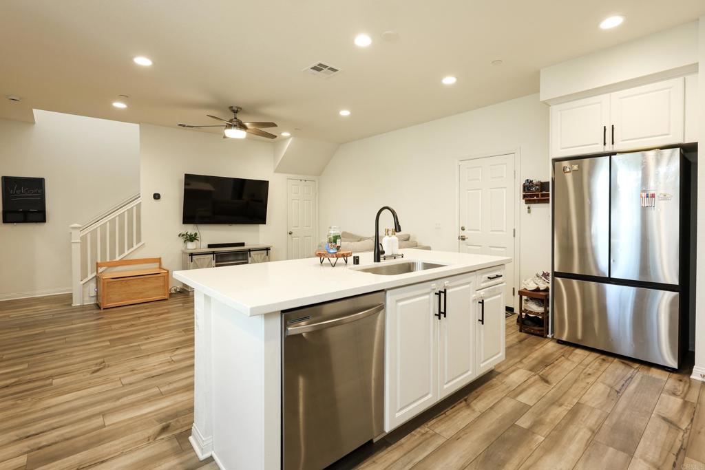 10443 Graphite Street Spring Valley, CA 91977 - Photo 13 of 18 a kitchen with a sink appliances and cabinets