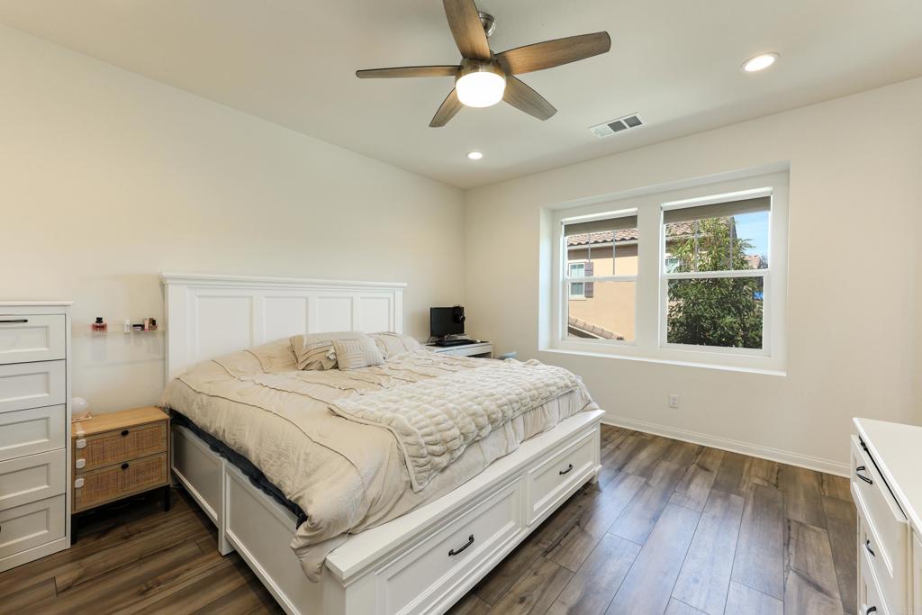 10443 Graphite Street Spring Valley, CA 91977 - Photo 6 of 18 a bedroom with a large bed and a window