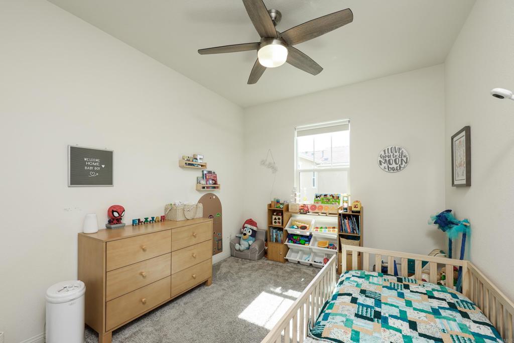 10443 Graphite Street Spring Valley, CA 91977 - Photo 10 of 18 a bedroom with a bed and a window