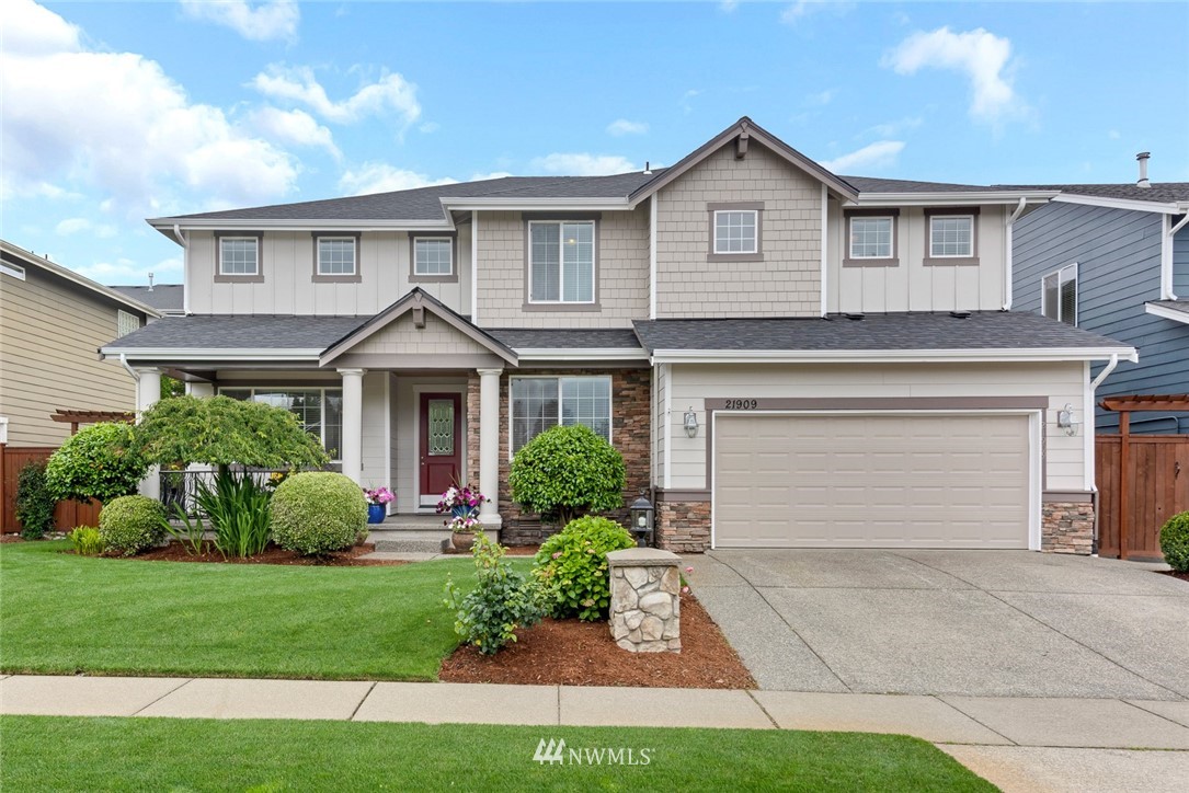 21909 39th Drive Southeast Bothell, WA 98021 - Photo 1 of 26 a front view of a house with garden