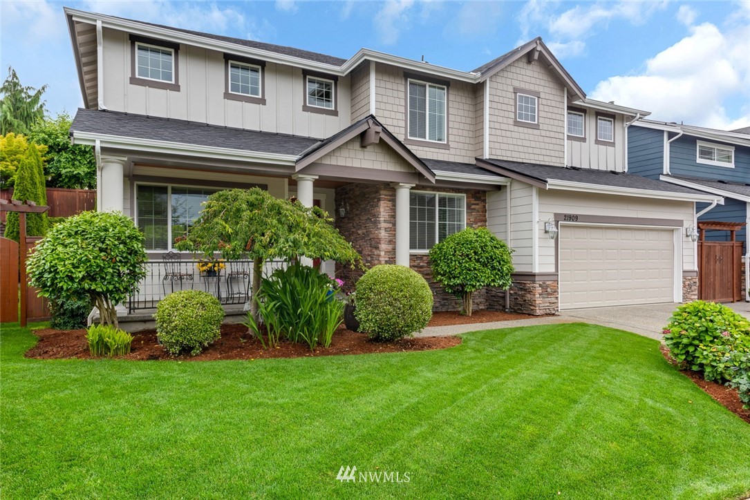 21909 39th Drive Southeast Bothell, WA 98021 - Photo 2 of 26 a view of a house with a yard and plants