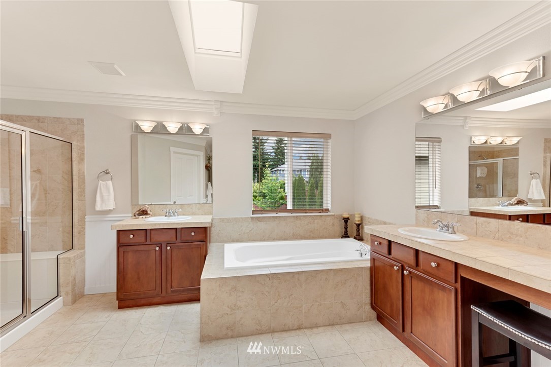 21909 39th Drive Southeast Bothell, WA 98021 - Photo 18 of 26 a spacious bathroom with a tub sink and mirror