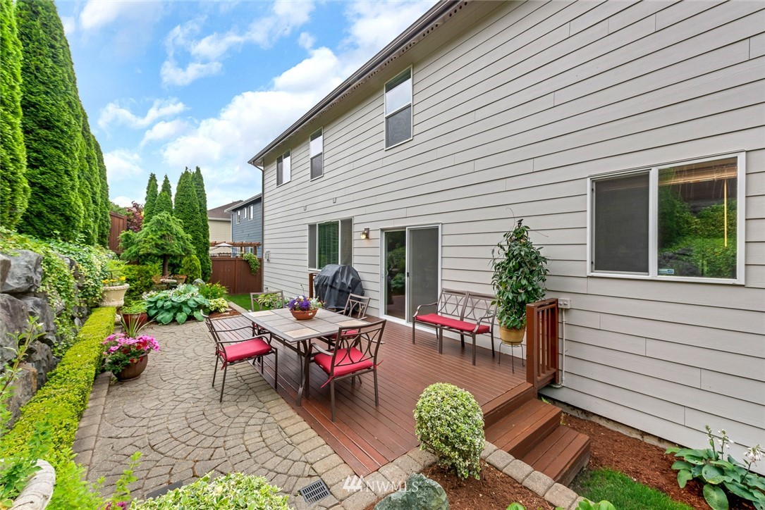21909 39th Drive Southeast Bothell, WA 98021 - Photo 25 of 26 a view of a house with backyard sitting area and garden