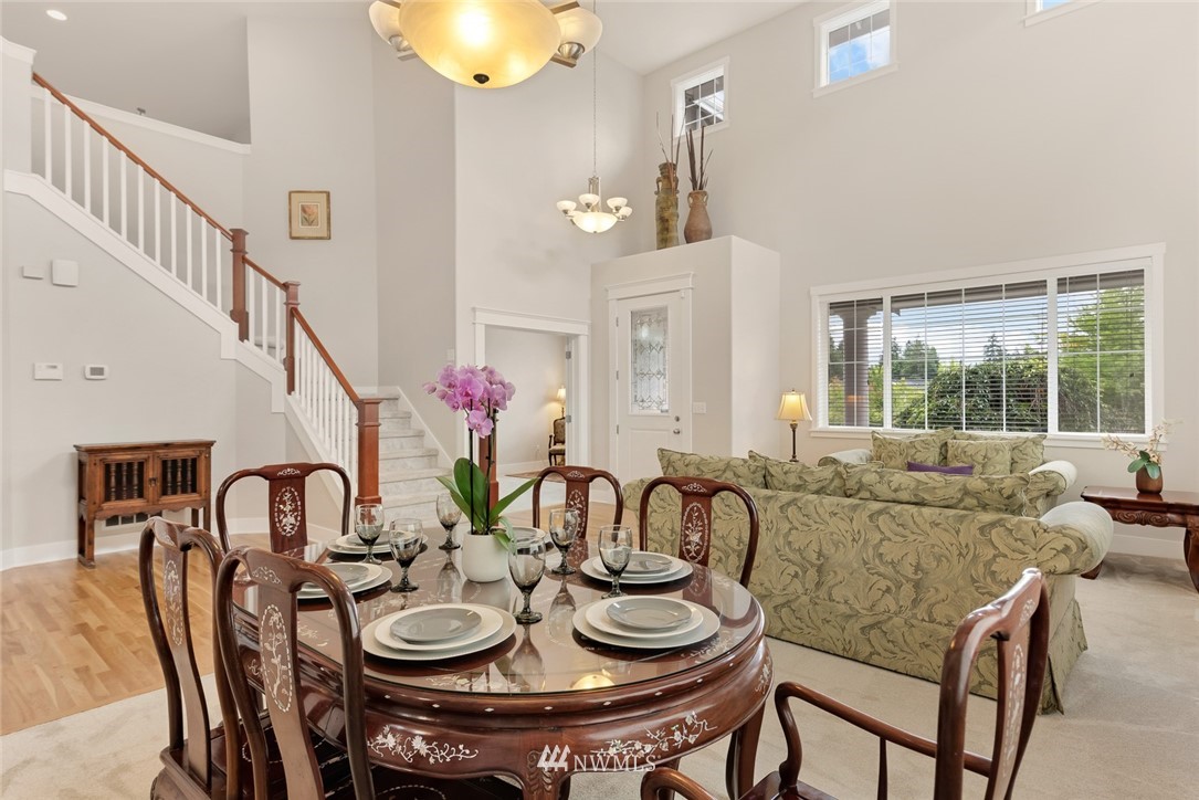 21909 39th Drive Southeast Bothell, WA 98021 - Photo 5 of 26 a view of a dining room with furniture and a chandelier
