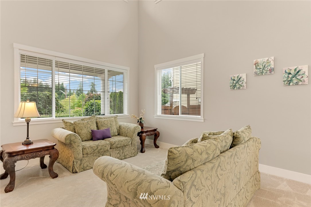 21909 39th Drive Southeast Bothell, WA 98021 - Photo 6 of 26 a living room with furniture and a window