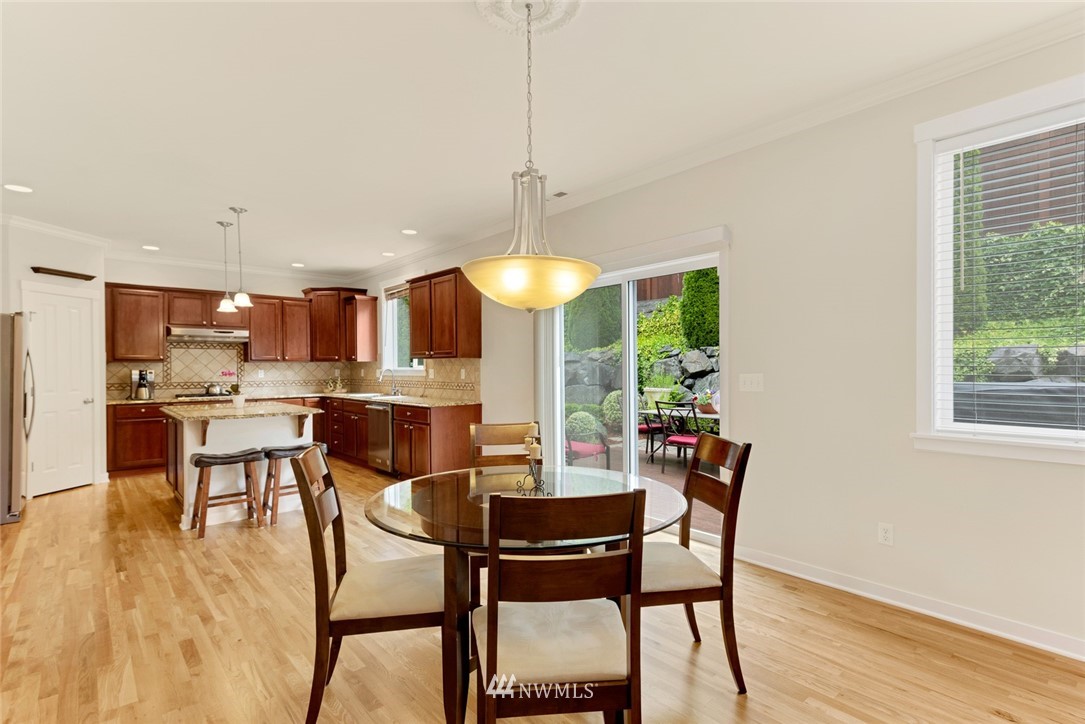 21909 39th Drive Southeast Bothell, WA 98021 - Photo 10 of 26 a view of a dining room with furniture and wooden floor