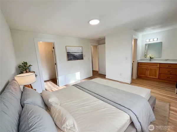 a bedroom with a bed and a couch