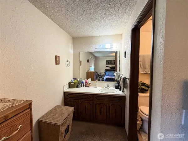 a bathroom with a sink double vanity and a mirror