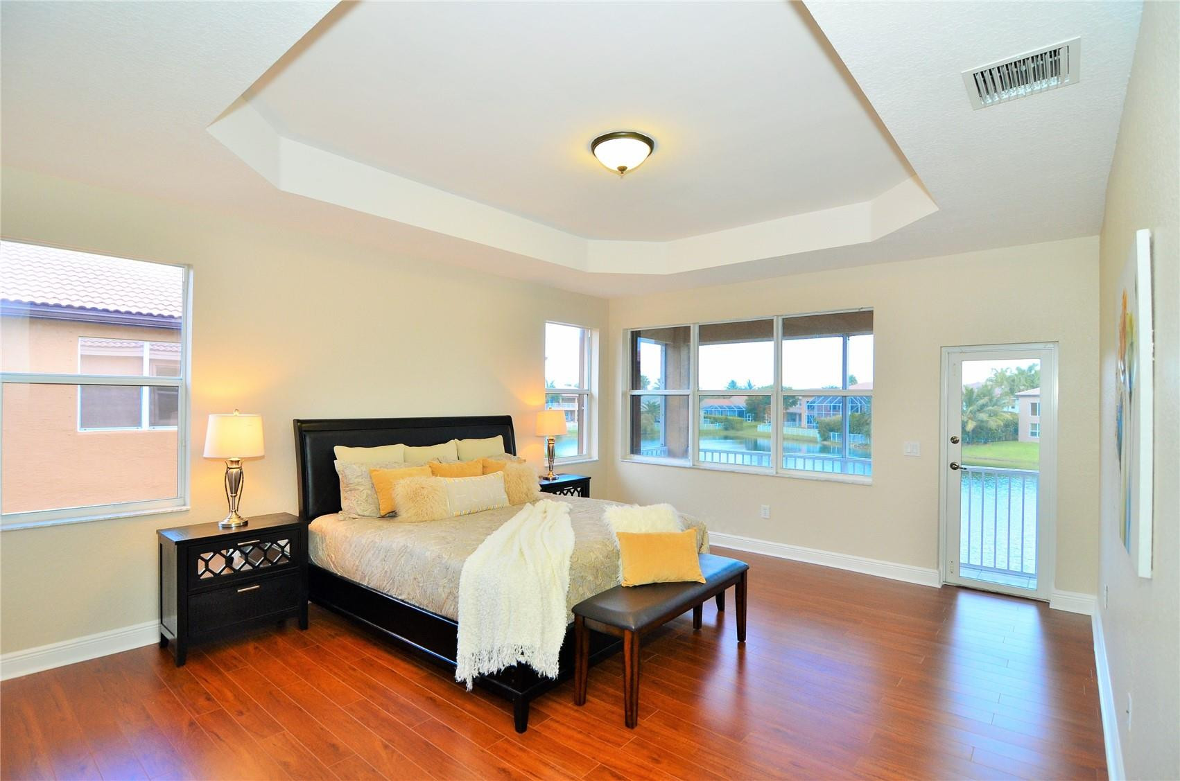 18602 Southwest 49th Street Miramar, FL 33029 - Photo 14 of 29 a bedroom with a bed and wooden floor