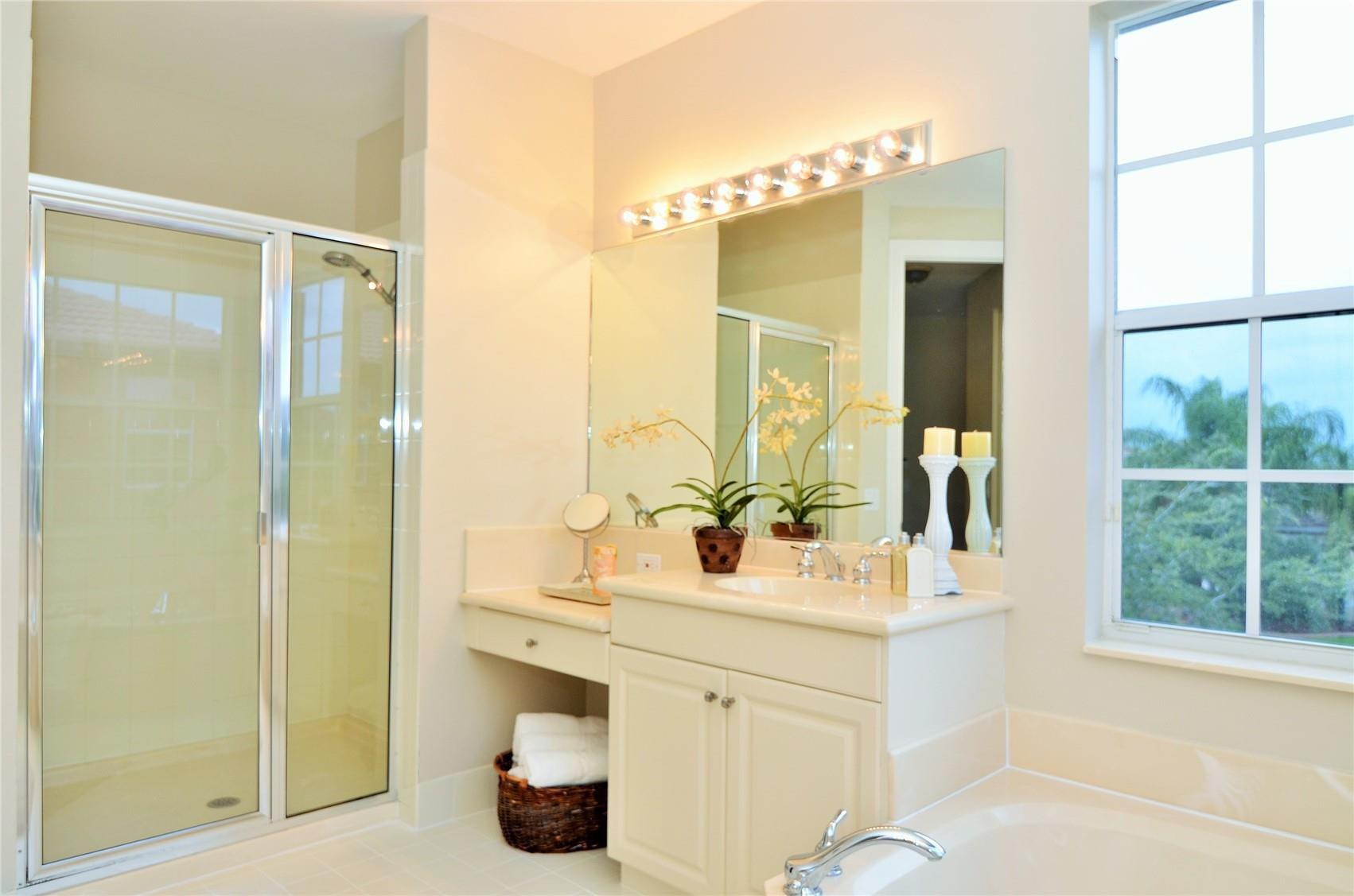 18602 Southwest 49th Street Miramar, FL 33029 - Photo 16 of 29 a bathroom with a double vanity sink mirror and shower