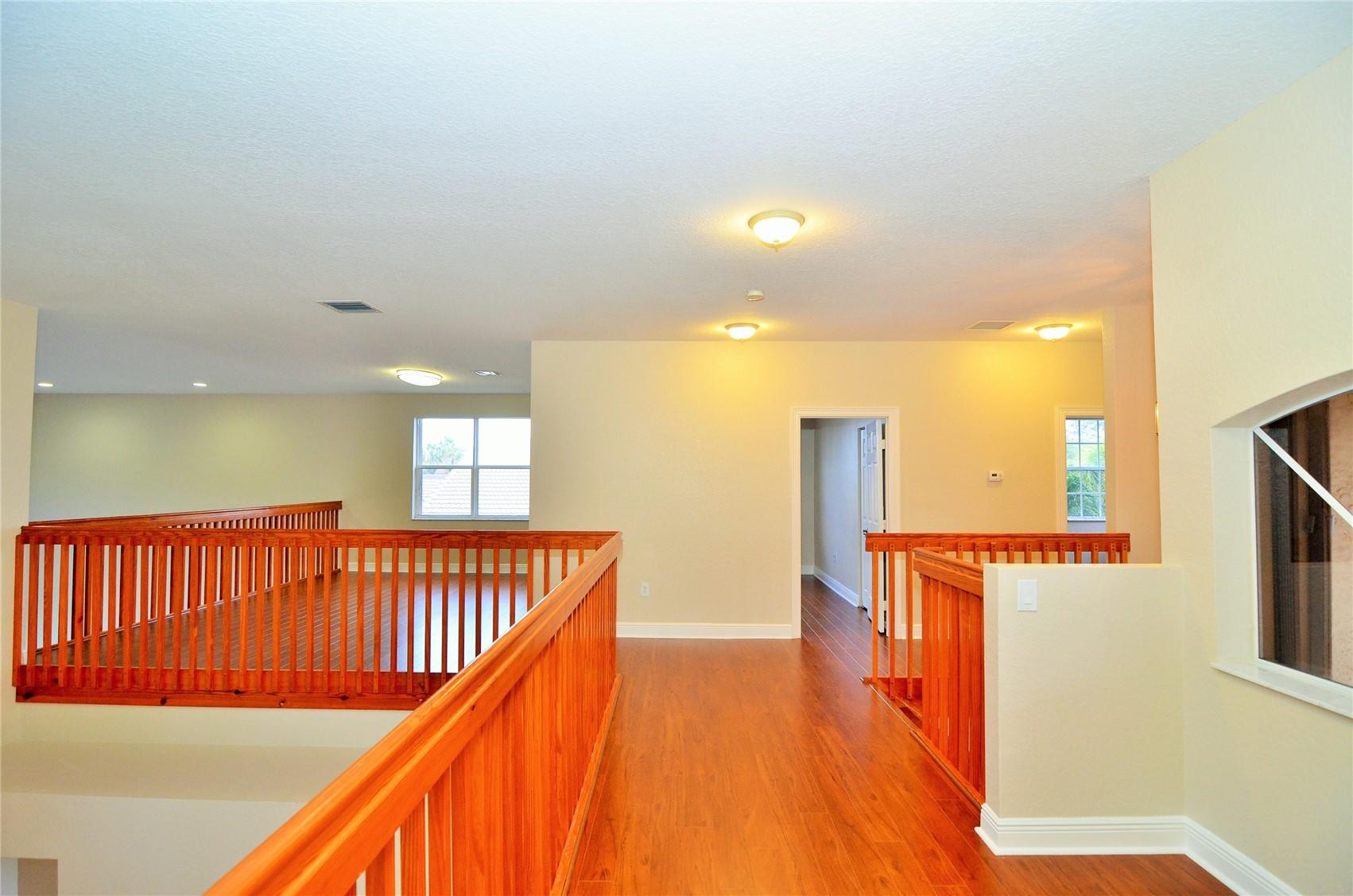 18602 Southwest 49th Street Miramar, FL 33029 - Photo 20 of 29 a hallway with a large window in front of living room