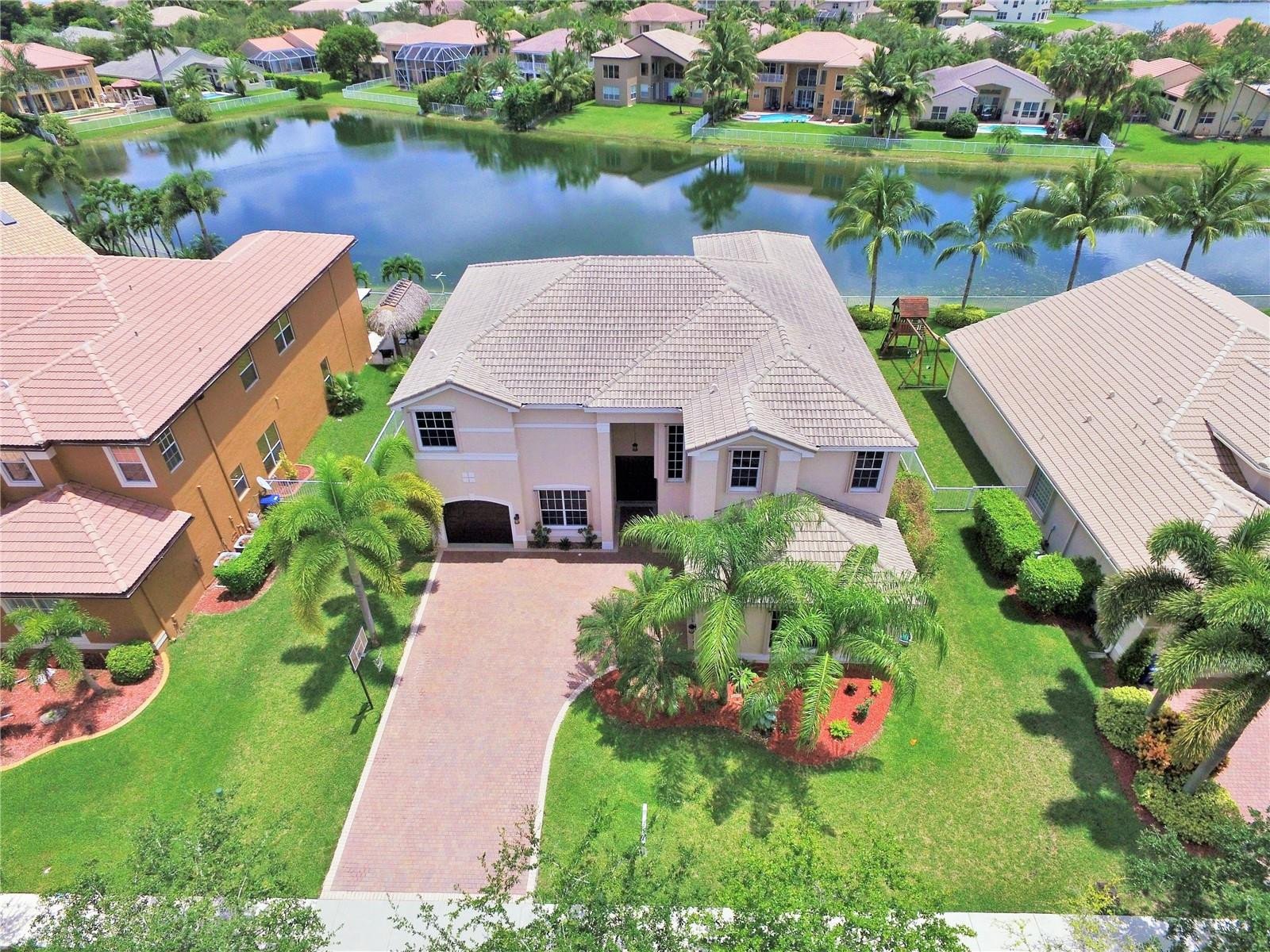 18602 Southwest 49th Street Miramar, FL 33029 - Photo 2 of 29 an aerial view of a house with garden space and lake view