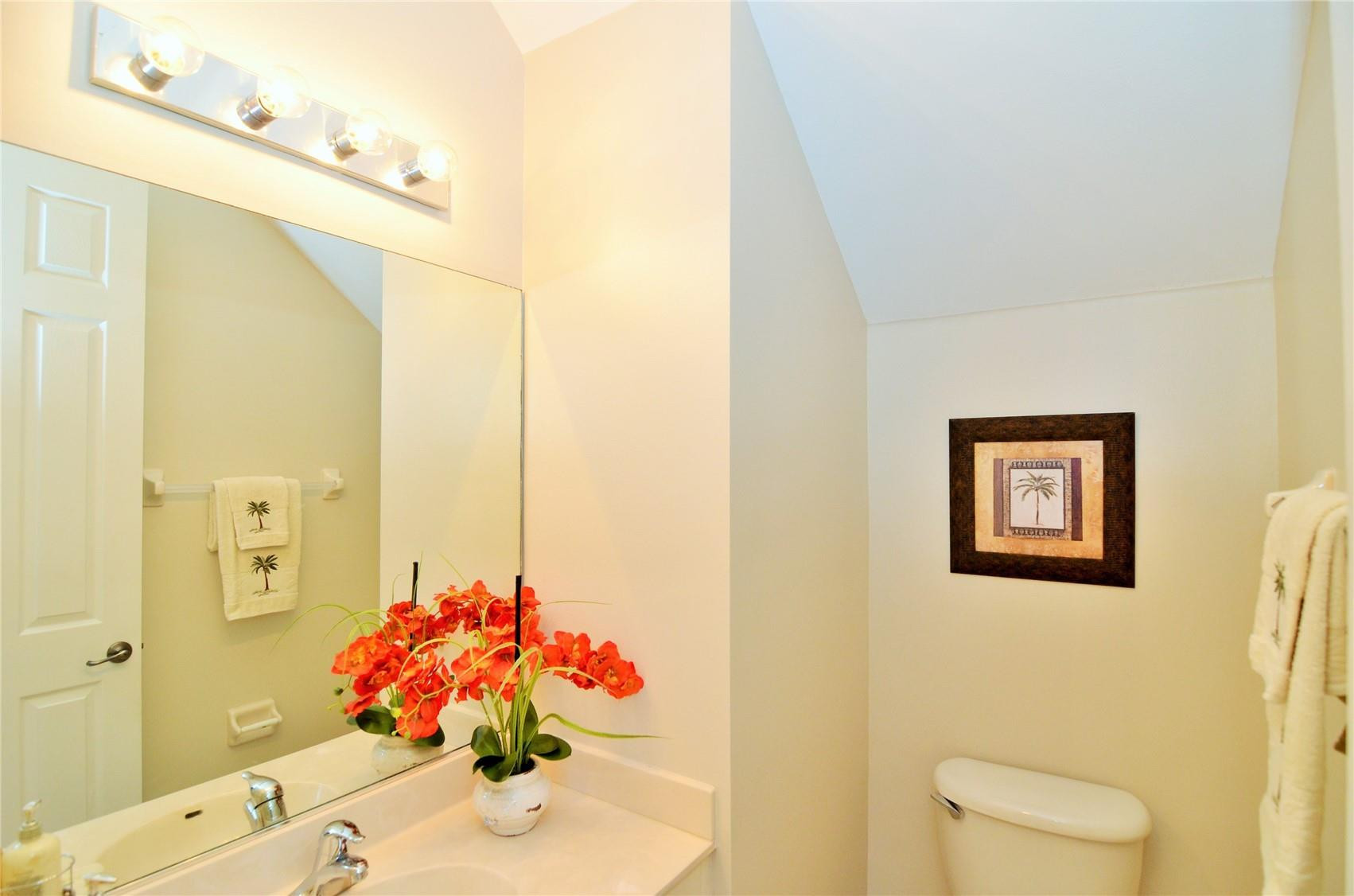 18602 Southwest 49th Street Miramar, FL 33029 - Photo 21 of 29 a bathroom with a sink mirror and a shower