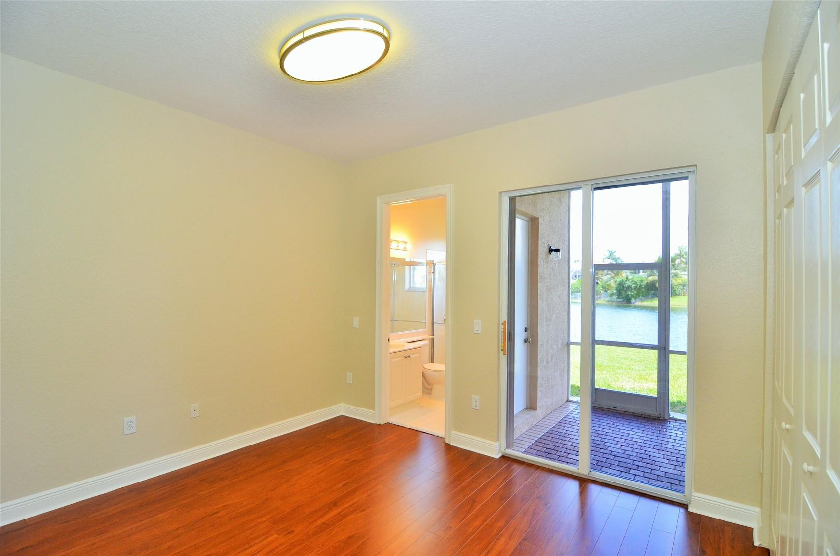 18602 Southwest 49th Street Miramar, FL 33029 - Photo 22 of 29 a view of empty room with wooden floor and fan