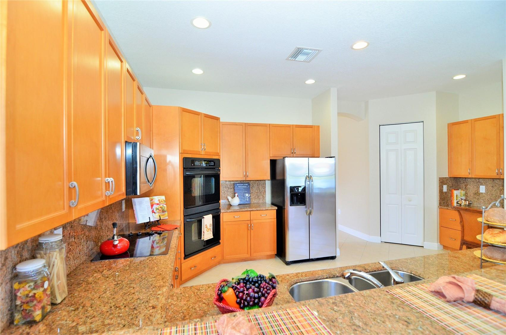 18602 Southwest 49th Street Miramar, FL 33029 - Photo 5 of 29 a living room with furniture kitchen view and a large window
