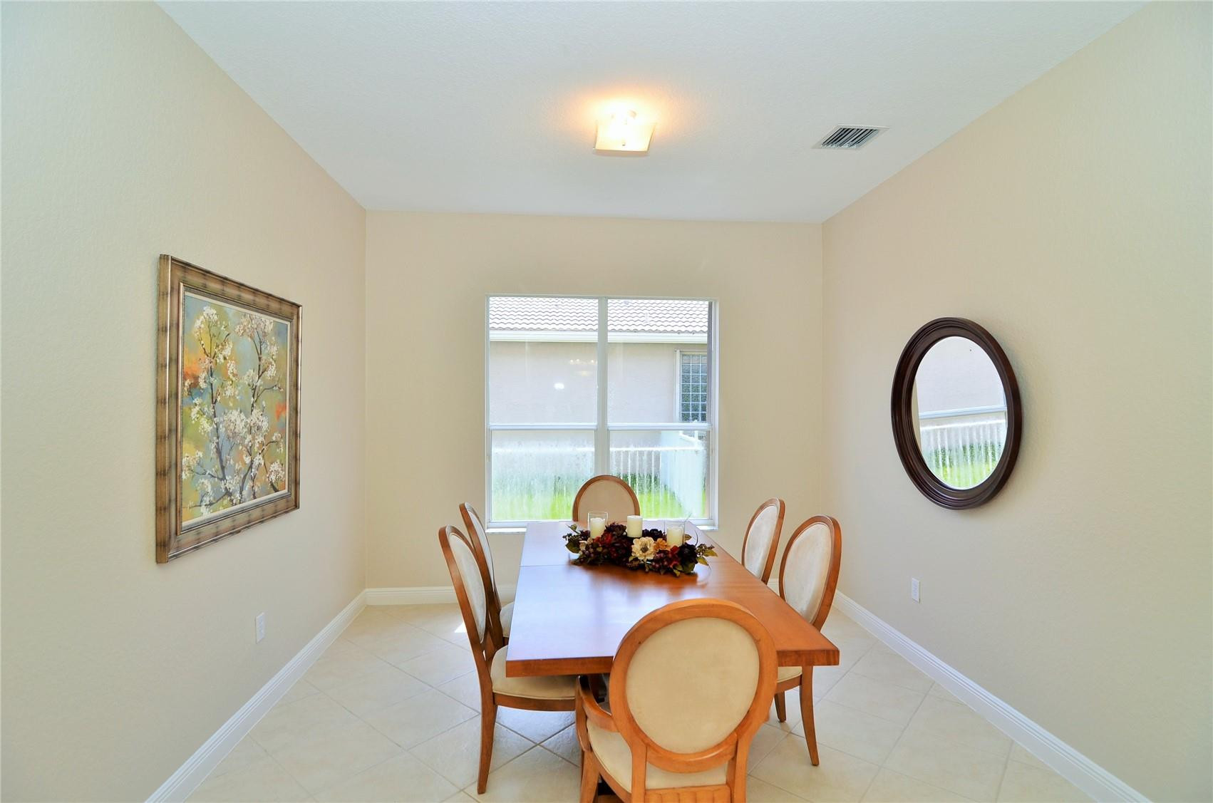 18602 Southwest 49th Street Miramar, FL 33029 - Photo 9 of 29 a dining room with furniture and a window