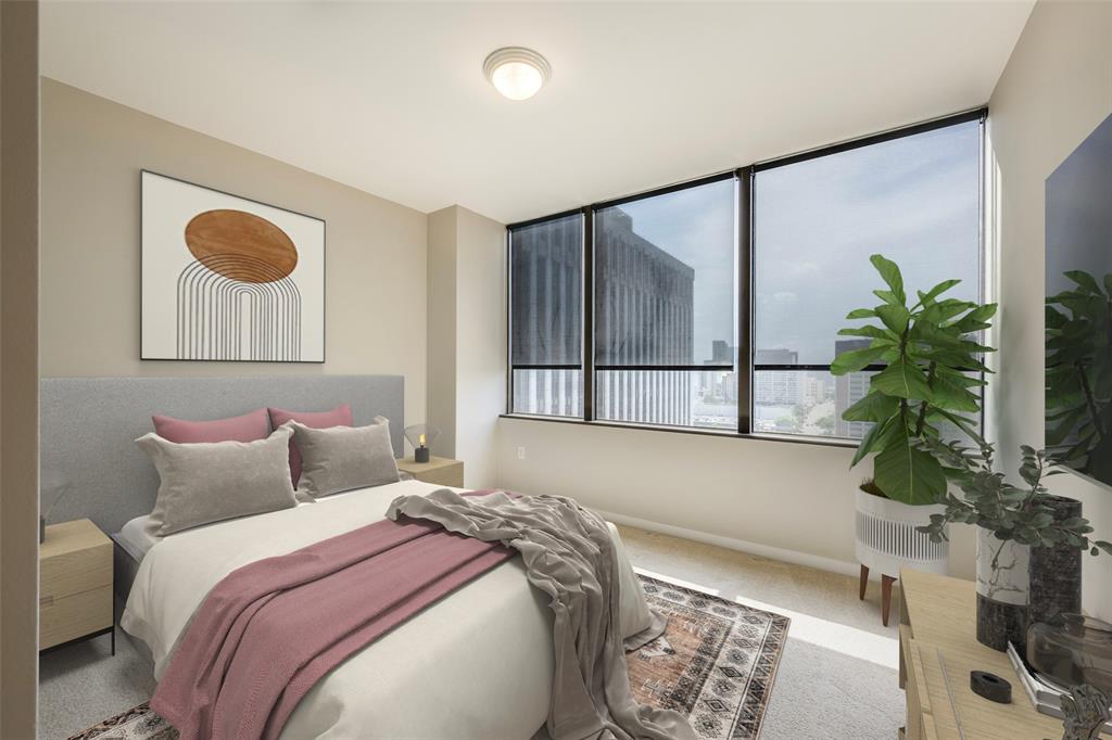 1200 Main Street, Unit 1002 Dallas, TX 75202 - Photo 14 of 30 a bedroom with a bed and a potted plant