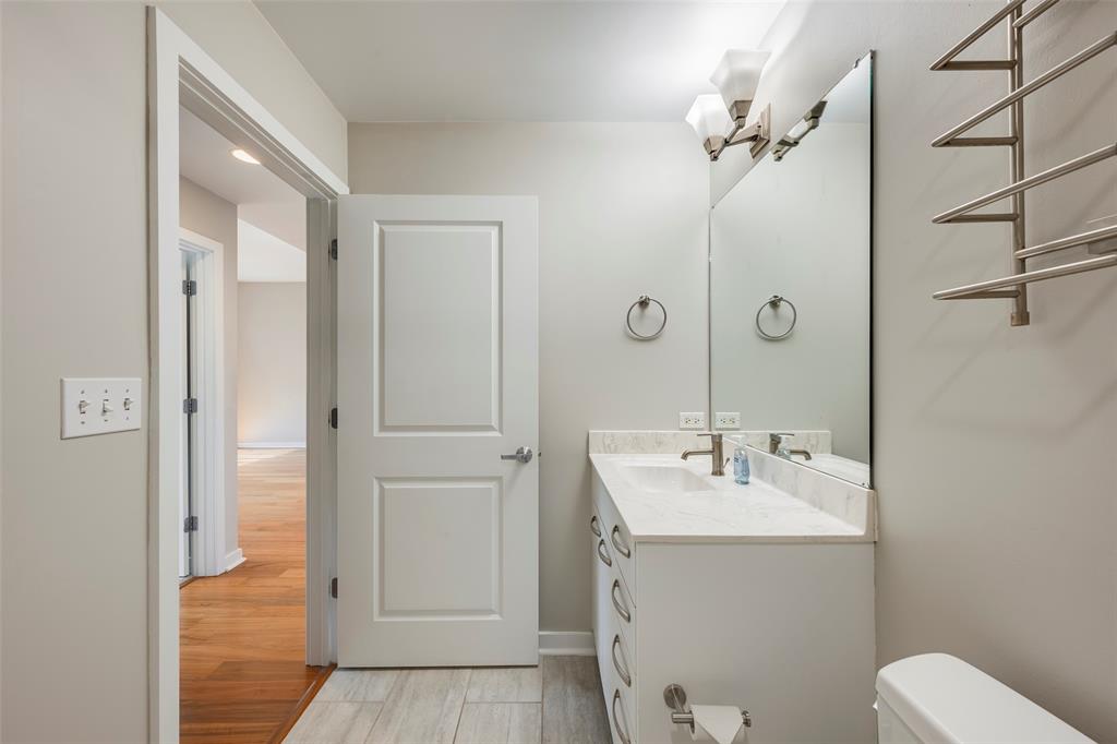 1200 Main Street, Unit 1002 Dallas, TX 75202 - Photo 24 of 30 a bathroom with a sink a toilet and shower