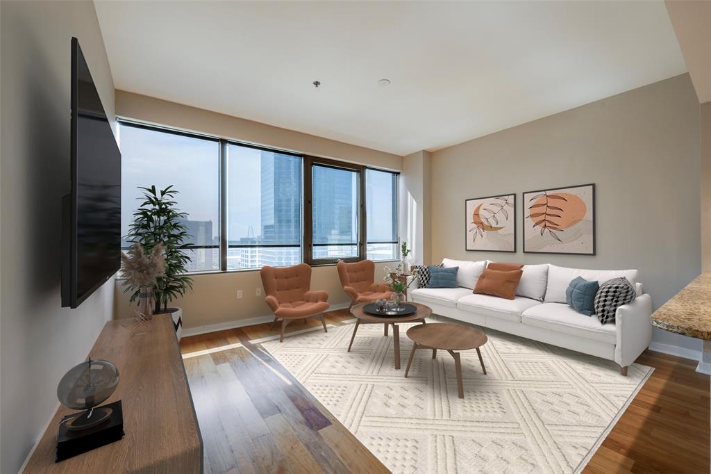 1200 Main Street, Unit 1002 Dallas, TX 75202 - Photo 7 of 30 a living room with furniture large window and flat screen tv