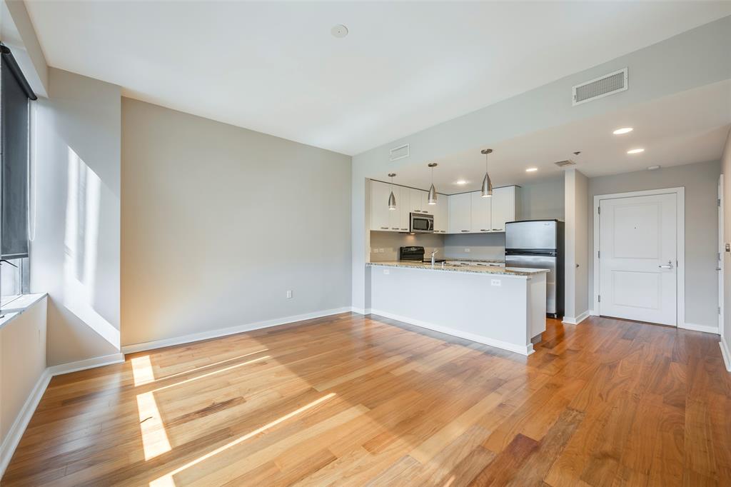 1200 Main Street, Unit 1002 Dallas, TX 75202 - Photo 10 of 30 a view of kitchen with wooden floor
