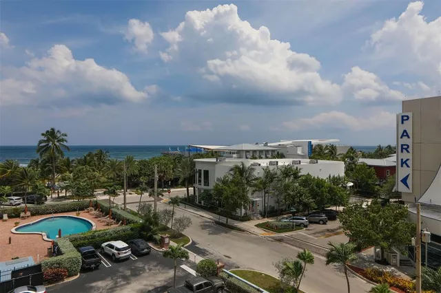 a view of a swimming pool and a yard