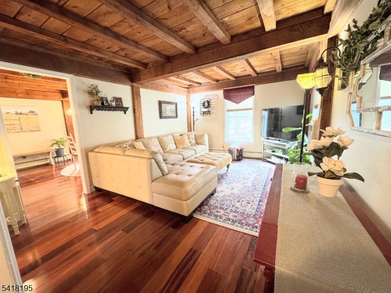 60 Plotts Road Newton, NJ 07860 - Photo 13 of 36 a living room with furniture and a wooden floor