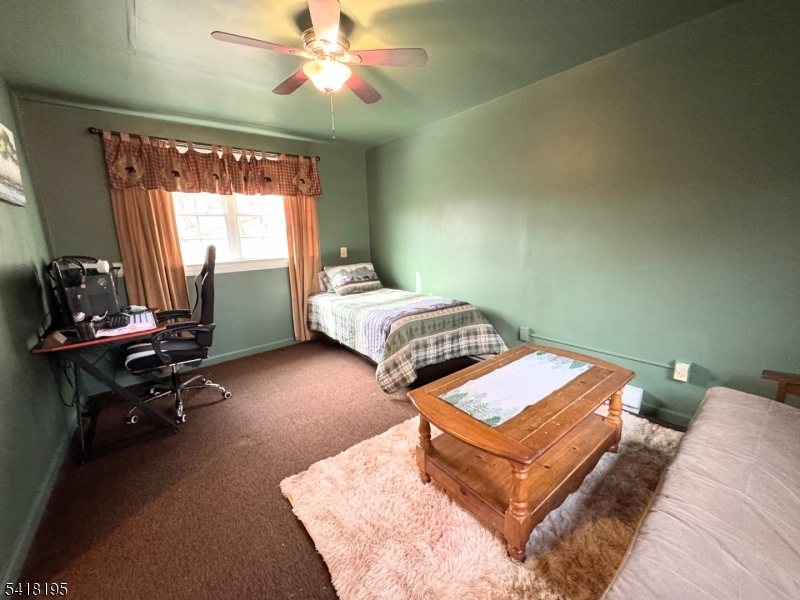 60 Plotts Road Newton, NJ 07860 - Photo 18 of 36 a living room with a bed furniture and a window