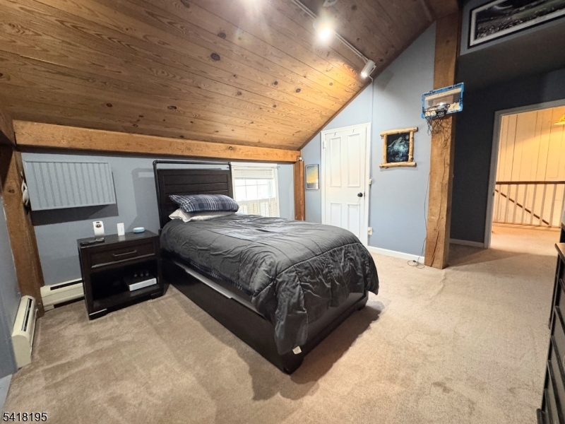 60 Plotts Road Newton, NJ 07860 - Photo 20 of 36 a spacious bedroom with a bed and large windows