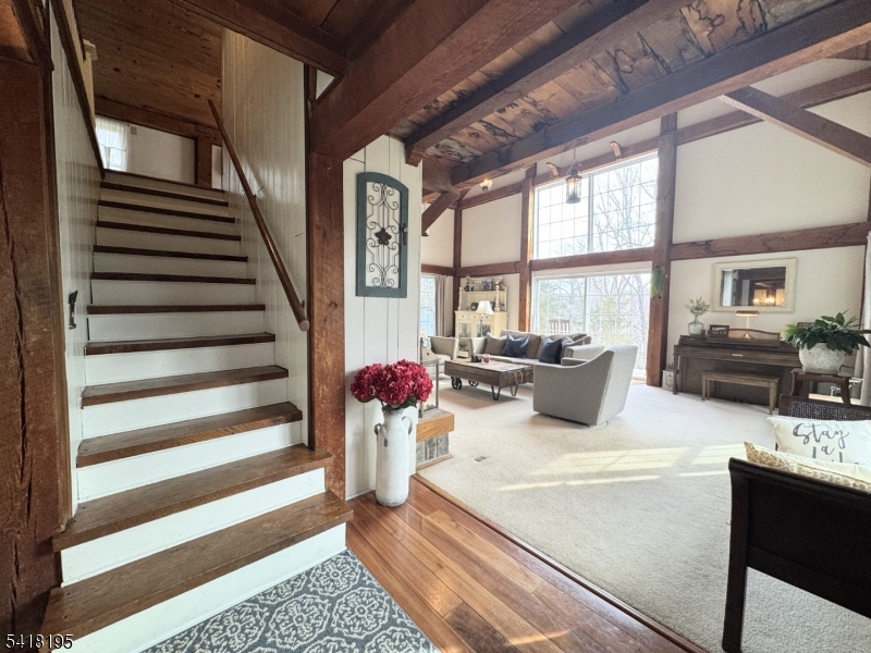 60 Plotts Road Newton, NJ 07860 - Photo 2 of 36 a living room with furniture and a floor to ceiling window
