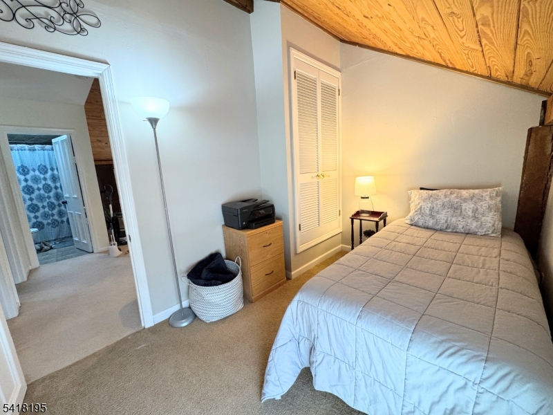 60 Plotts Road Newton, NJ 07860 - Photo 23 of 36 a bedroom with a bed and a window