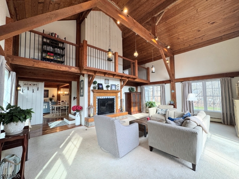 60 Plotts Road Newton, NJ 07860 - Photo 4 of 36 a living room with furniture a fireplace and potted plants