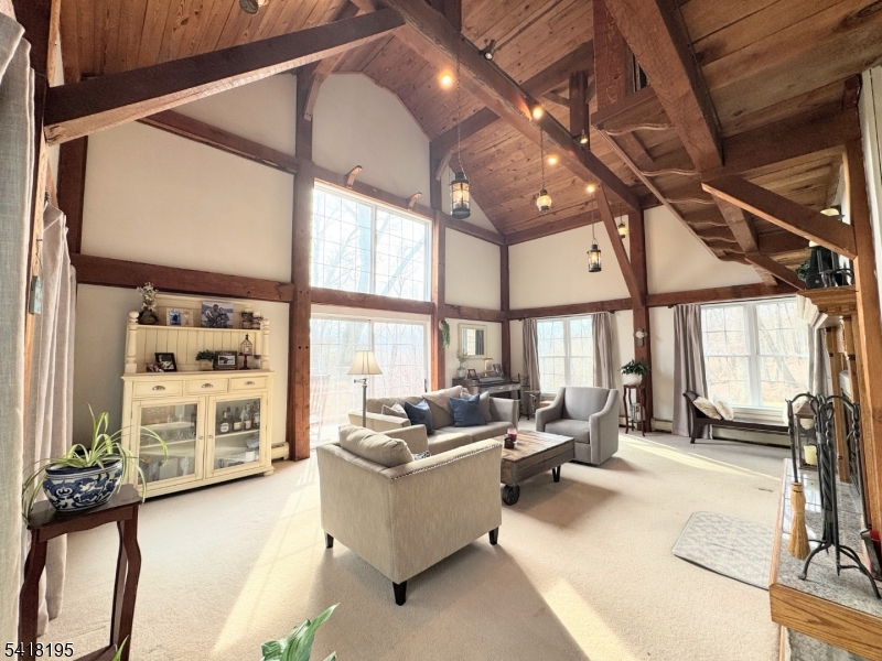 60 Plotts Road Newton, NJ 07860 - Photo 6 of 36 a living room with furniture fireplace and large windows