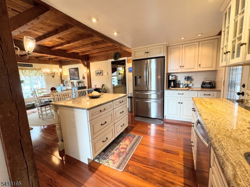 60 Plotts Road Newton, NJ 07860 - Photo 8 of 36 a kitchen with stainless steel appliances kitchen island granite countertop a refrigerator and a stove top oven