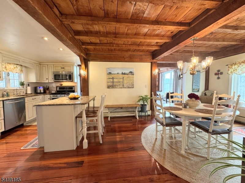 60 Plotts Road Newton, NJ 07860 - Photo 10 of 36 a view of a dining room with furniture window and wooden floor