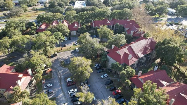 an aerial view of residential house with outdoor space and swimming pool